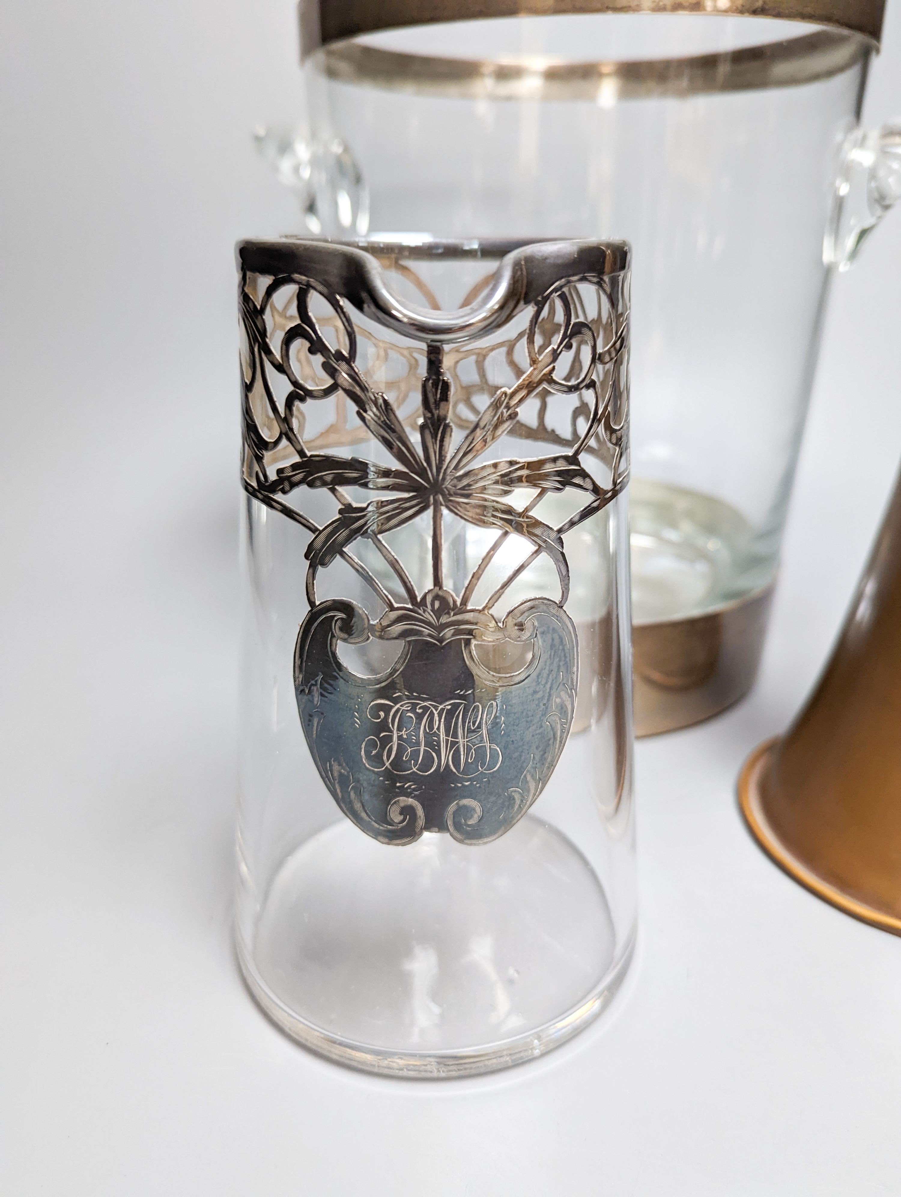 A copper plated silver base by Charles and Richard Comyns, London 1924, a large silver-mounted wine cooler and a glass jug